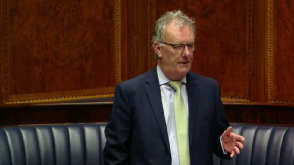 Mike Nesbitt standing in the Stormont chamber on 14 September 2021