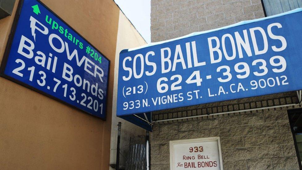 Signs advertise bail bond companies on August 29, 2018 in Los Angeles, California