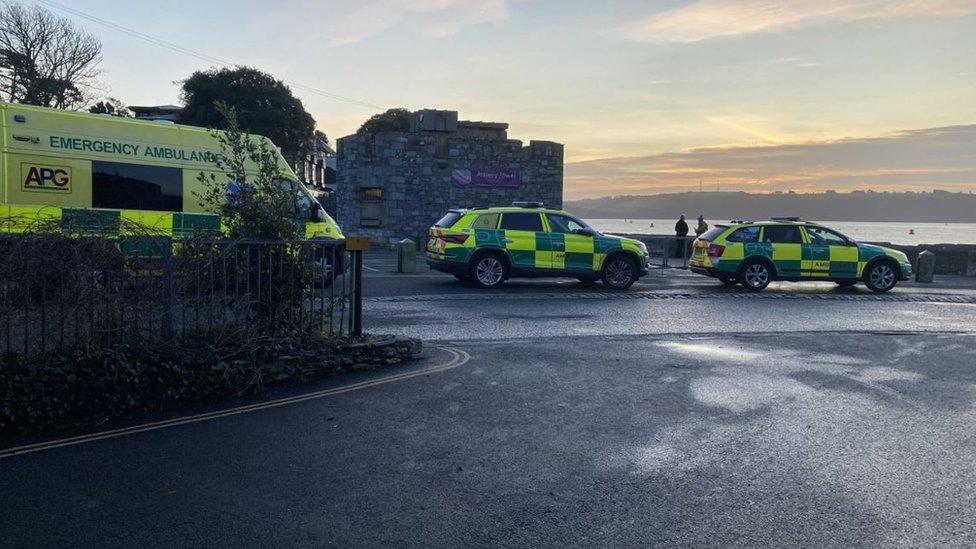 An ambulance and two emergency response vehicles at Firestone Bay