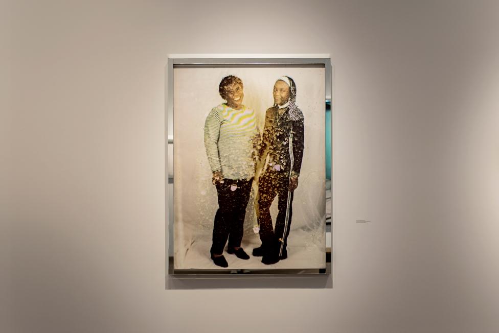 Framed portrait of two women standing side by side