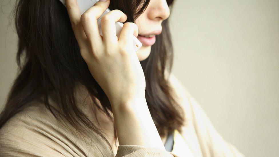 Anonymous woman on phone