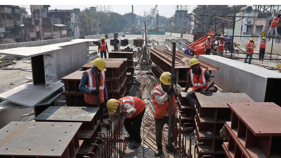 Workers at flyover construction site in Kolkata