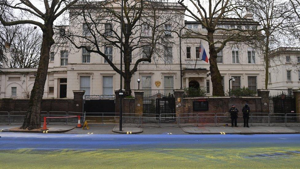 Stretch of Bayswater Road outside the Russian Embassy painted blue and yellow by Led by Donkeys