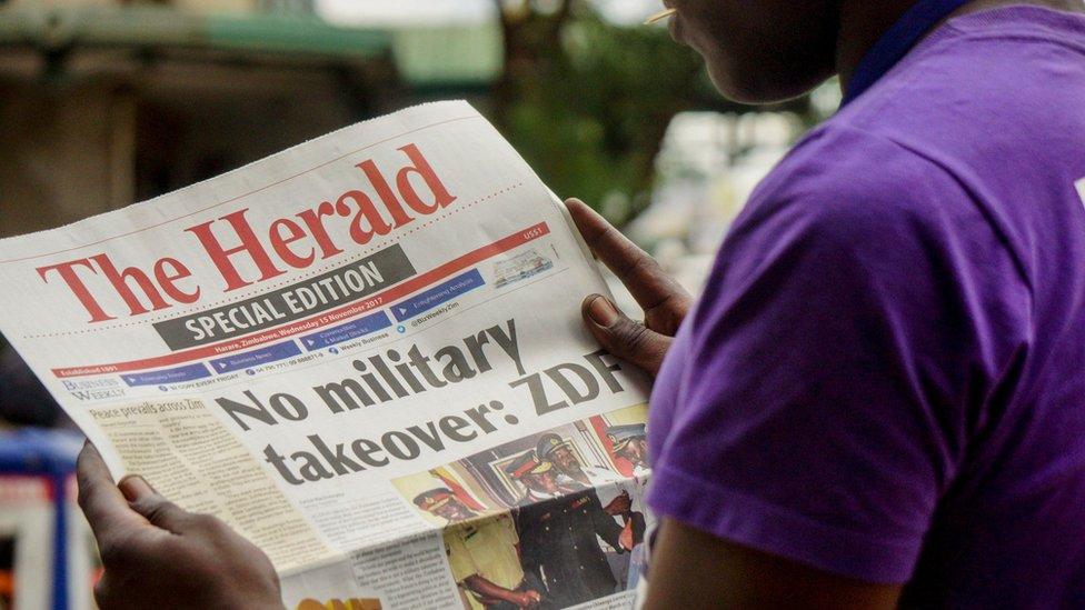 Man reading newspaper