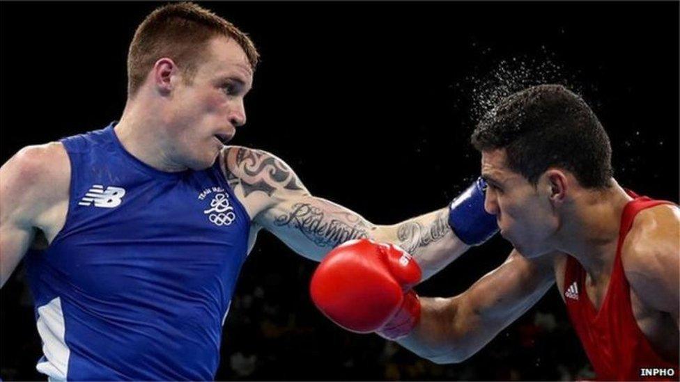 Steven Donnelly lands a punch during his Olympic quarter-final defeat by Mohammed Rabii