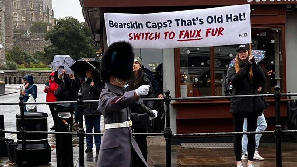 soldier in front of banner