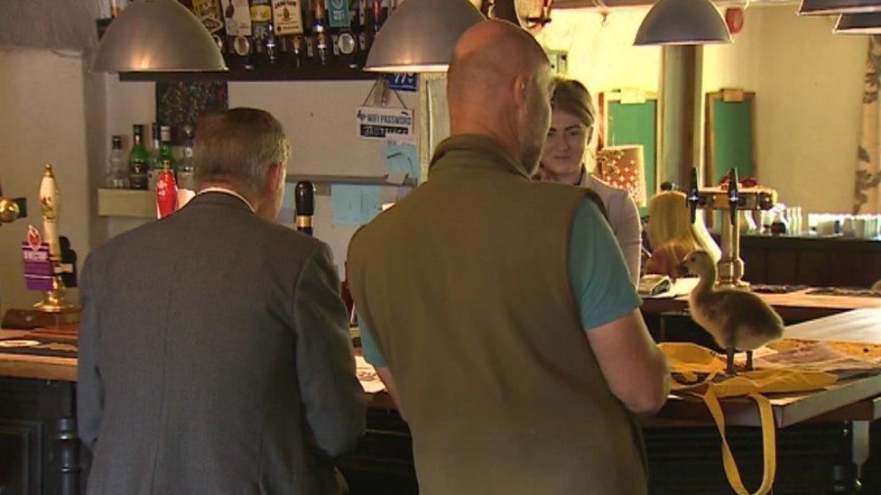 Gosling on bar at pub with nigel Greaves