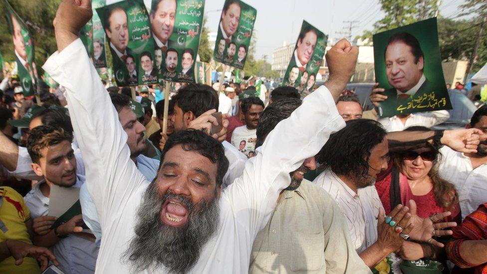 Supporters of Pakistan's Prime Minister Nawaz Sharif celebrate following the Supreme Court's decision in Lahore, Pakistan on 20 April 2017