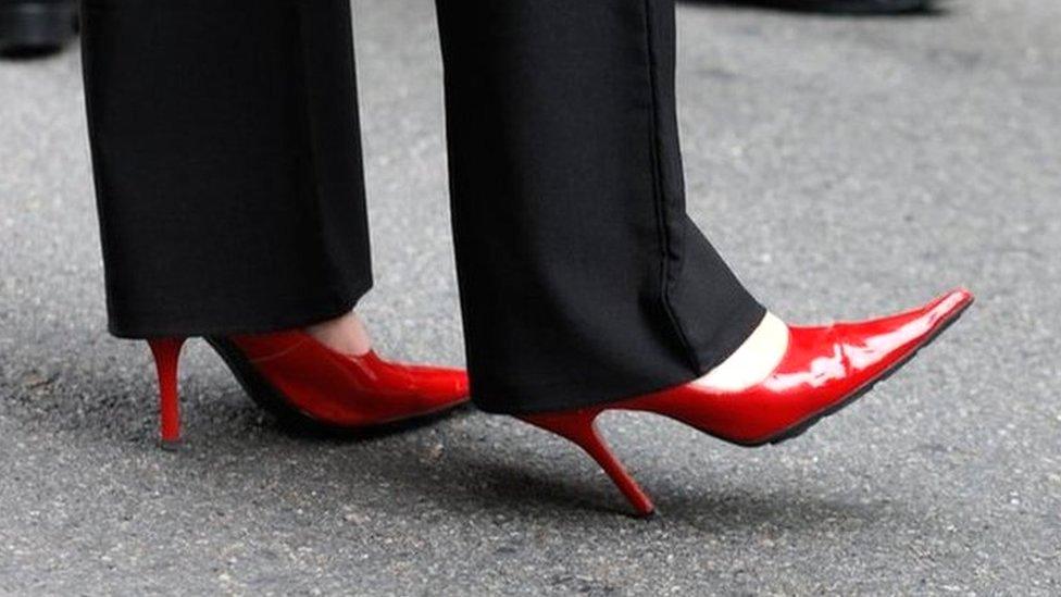 Woman wearing high heeled shoes