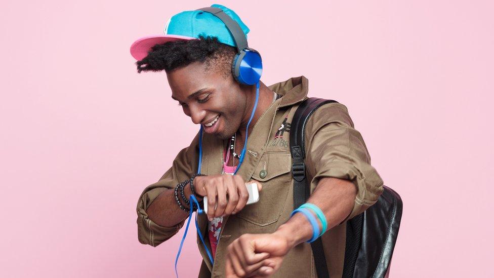 Man listening to music on headphones