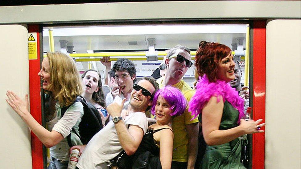 Revellers on the tube