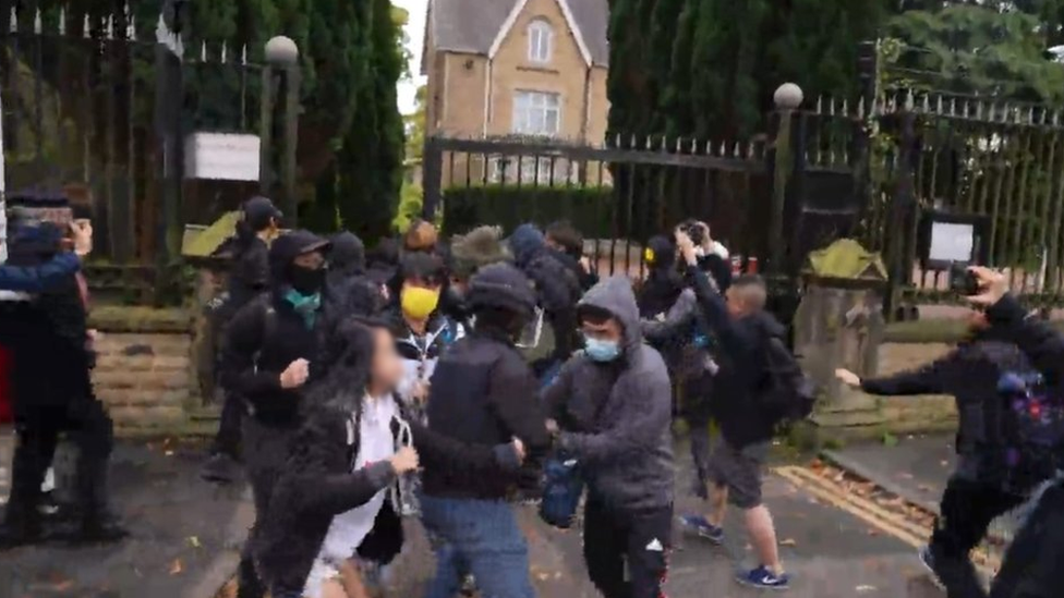 A still from a video shows a scuffle outside the consulate