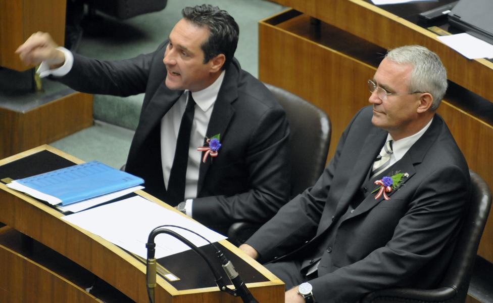 Austrian Freedom Party members Heinz Christian Strache and Martin Graf wear cornflowers in the Austrian parliament in 2008