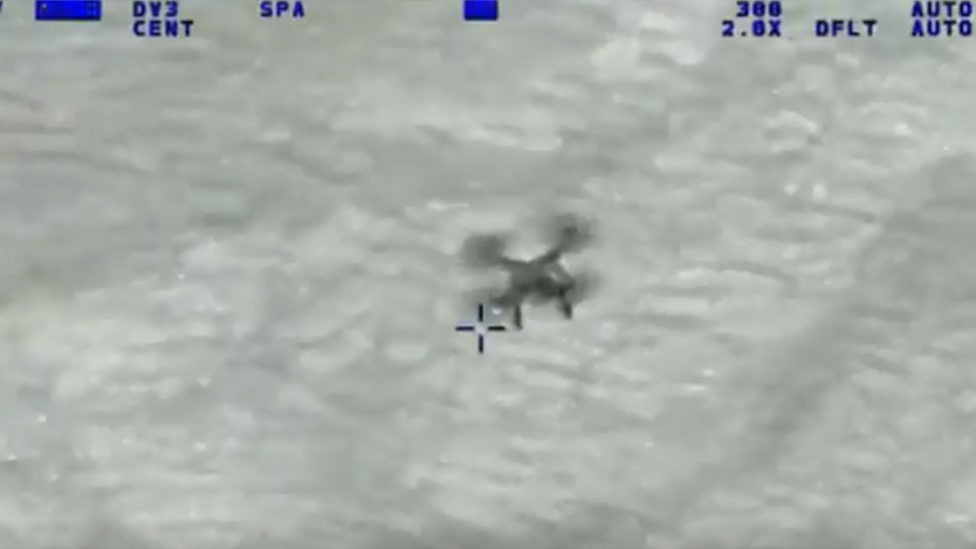 Drone filmed by police helicopter