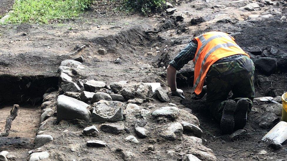 Archaeologists uncovered a masonry wall at the site