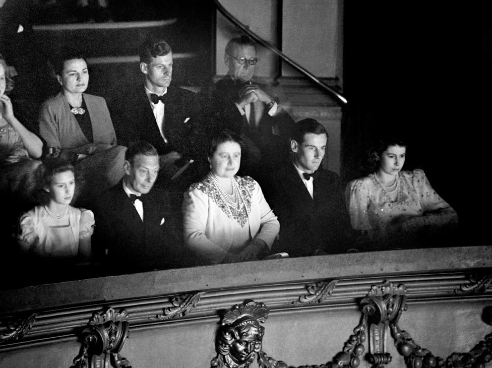 Princess Margaret, King George VI, Queen Elizabeth, Group Captain Peter Townsend and Princess Elizabeth in the Royal Box at the Strand Theatre (August 1946)