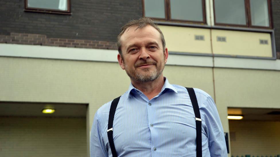 Phil Murphy outside his tower block