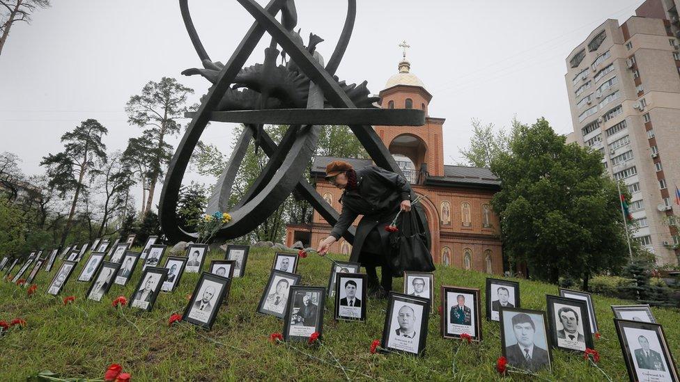 Photos of the victims laid out in Kiev on 26 April 2016