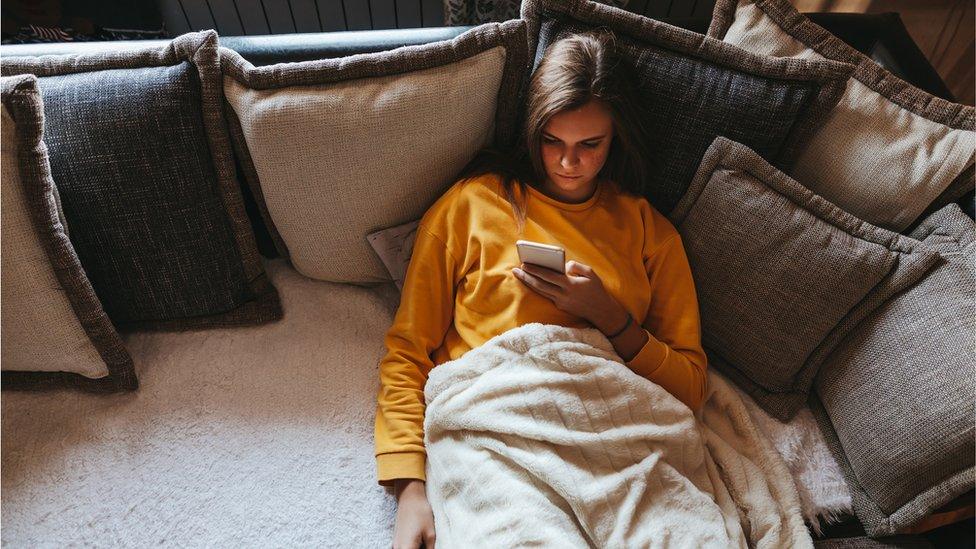 Woman scrolling phone