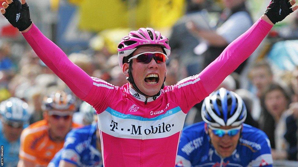 Mark Cavendish holds his arms aloft and shouts with joy as he wins a stage at the Giro d'Italia