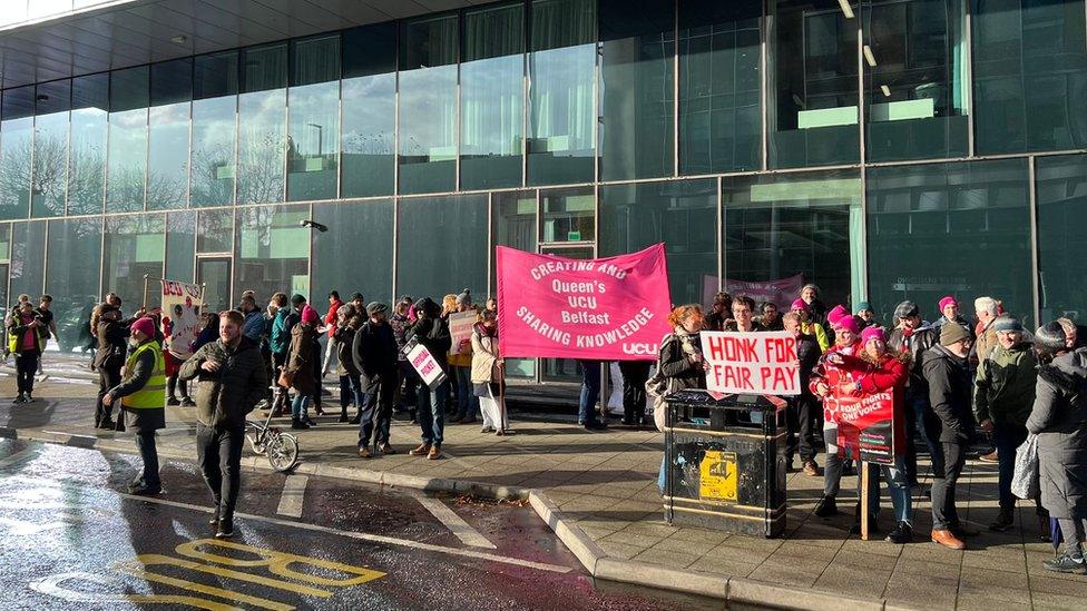 Staff gather outside Ulster University during the UCU strikes