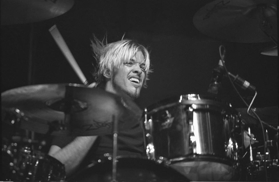 Drummer Taylor Hawkins is shown performing on stage during a "live" concert appearance with the Foo Fighters on 2 April 2000.