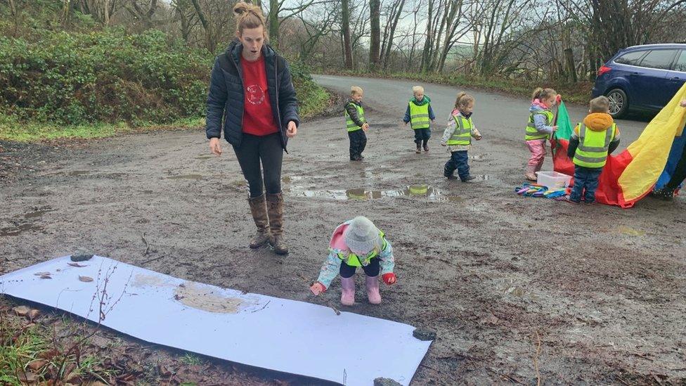 Children were taking part in mud painting