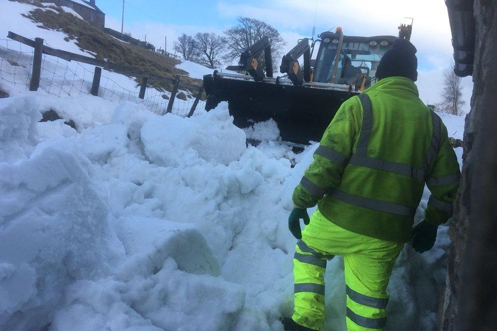 Snow plough clearing a passage way in front of Gwen and Stan's house in Nenthead, Cumbria