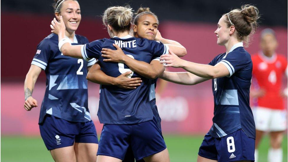 Ellen White celebrates with teammates