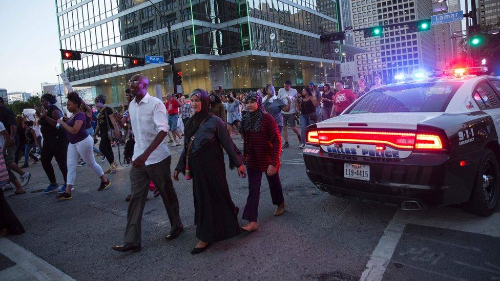 Protesters marching along a street in the central business district of Dallas - 7 July 2016