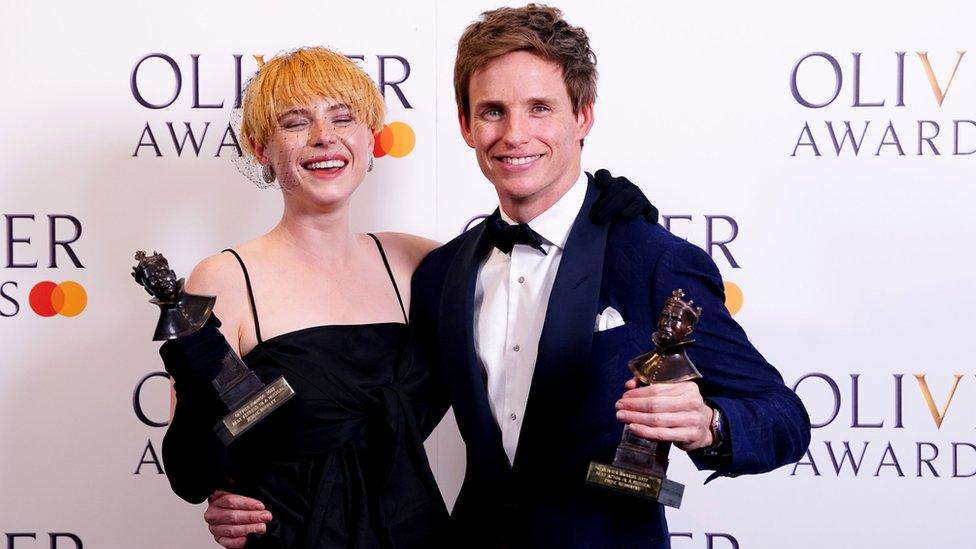 Jessie Buckley and Eddie Redmayne with their Olivier awards