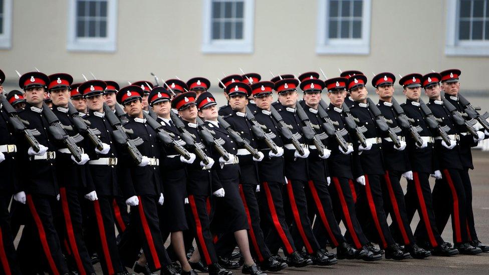 Male and female cadets platoons pass out together for the first time during the Sovereign"s Parade at the Royal Military Academy Sandhurst.