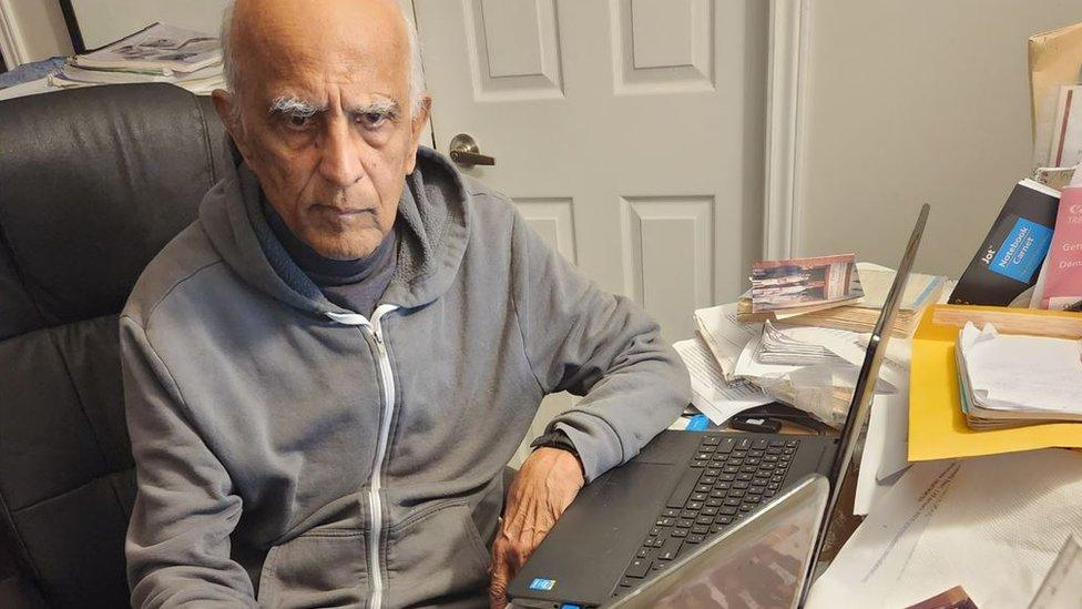 Shamshu Deen at his work desk