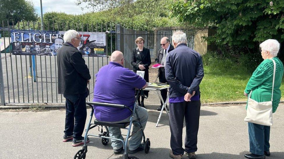 Radio enthusiasts holding a minute silence