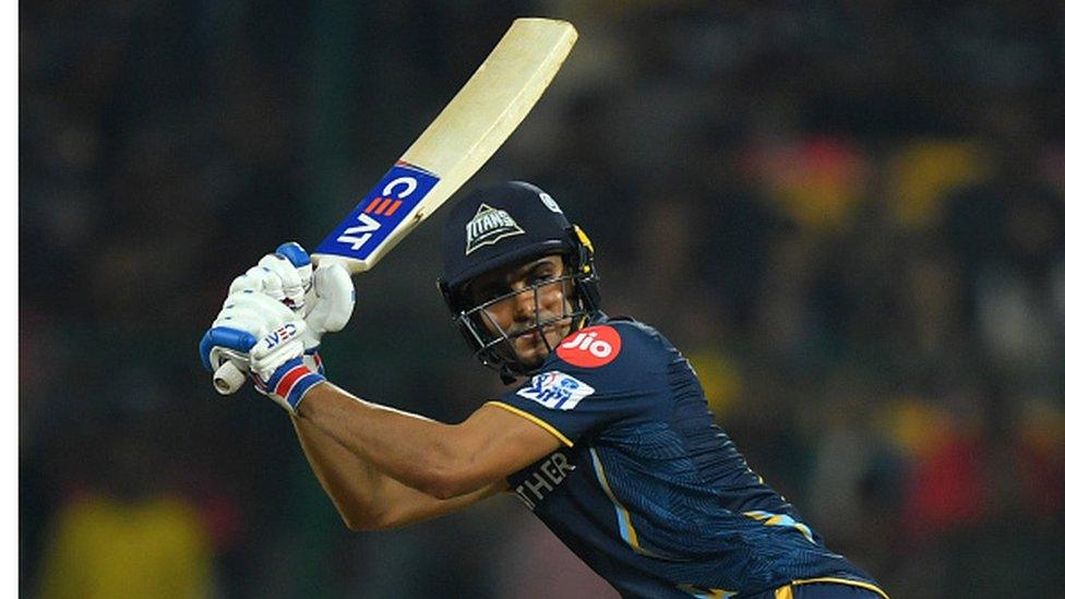 Gujarat Titans' Shubman Gill watches the ball after playing a shot during the Indian Premier League (IPL) Twenty20 cricket match between Royal Challengers Bangalore and Gujarat Titans at the M Chinnaswamy Stadium in Bengaluru on May 21, 2023. (Photo by Manjunath KIRAN / AFP) (Photo by MANJUNATH KIRAN/AFP via Get