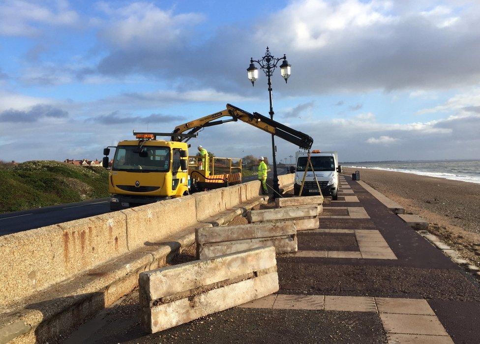 Workers repairing the promenade at Southsea, Hampshire