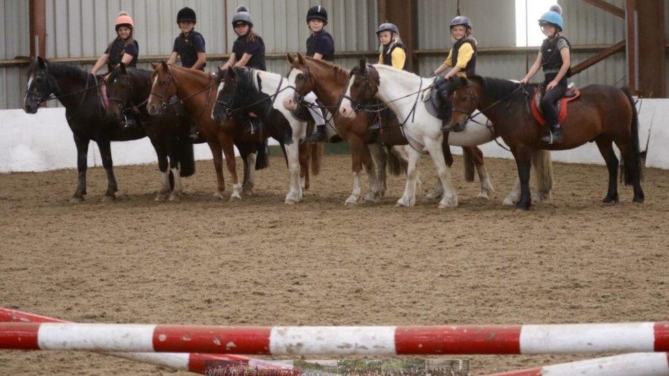 Children ride ponies