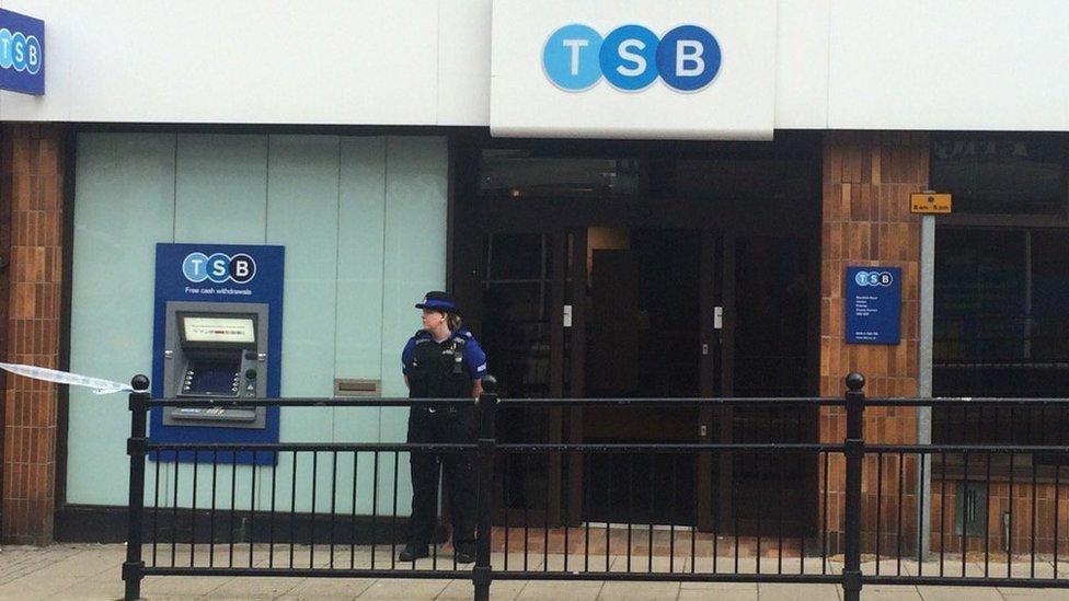 A police officer guards the TSB bank in Horden