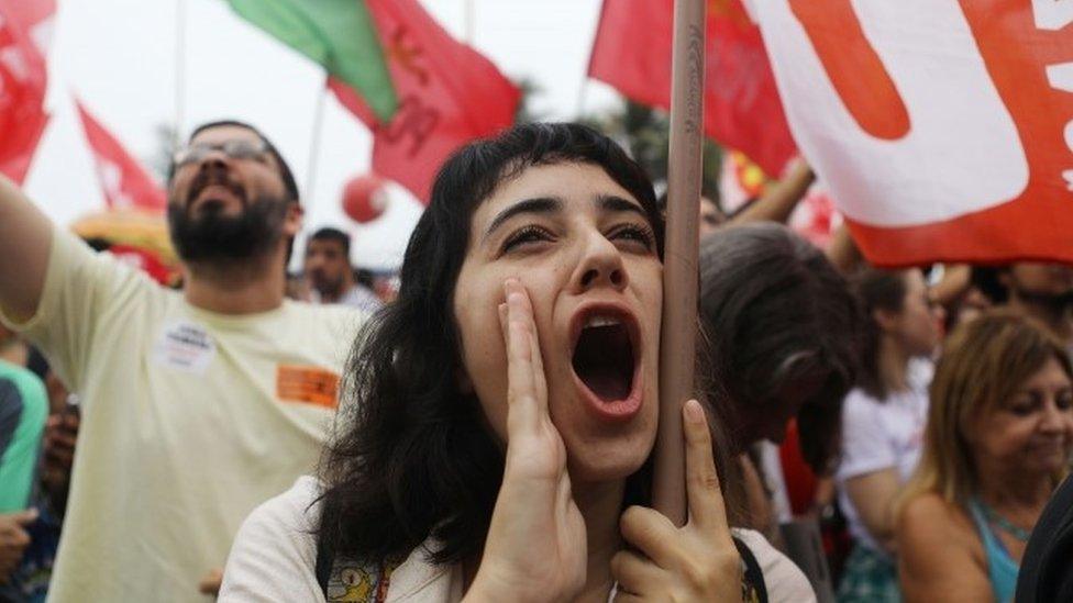 Protesters rally at a demonstration and concert in Rio de Janiero calling for direct presidential elections