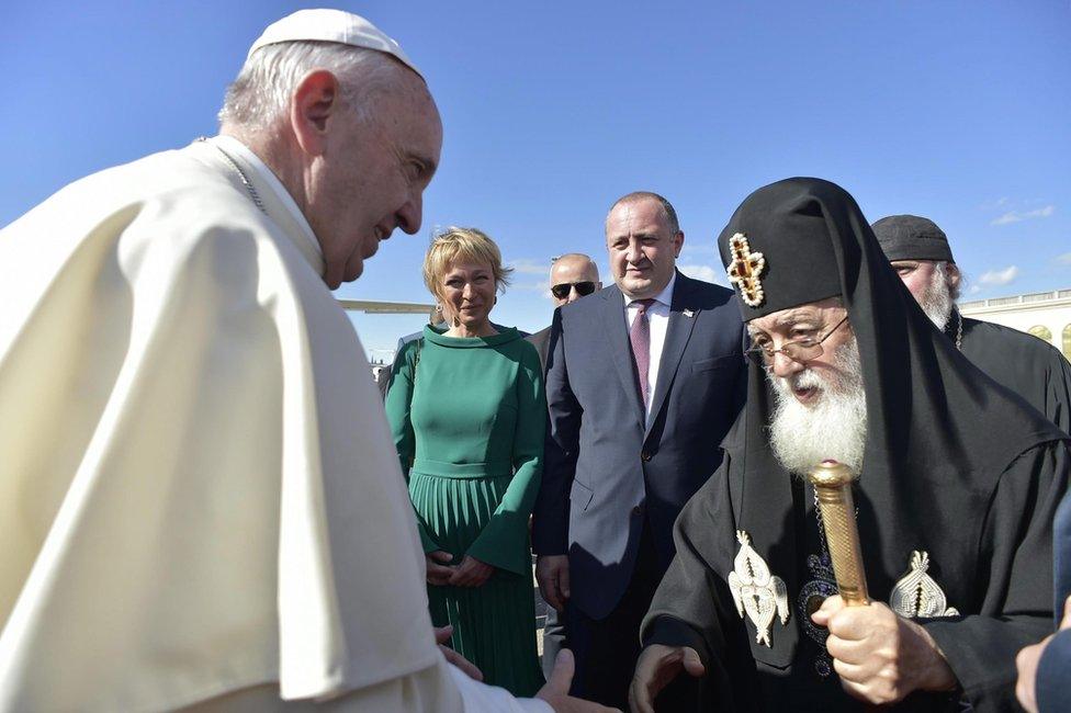 Pope Francis (left) is greeted by Patriarch Ilia in Tbilisi, 30 September