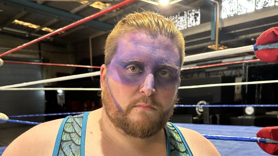 Calum Thompson, a wrestler in Norwich with purple face paint on