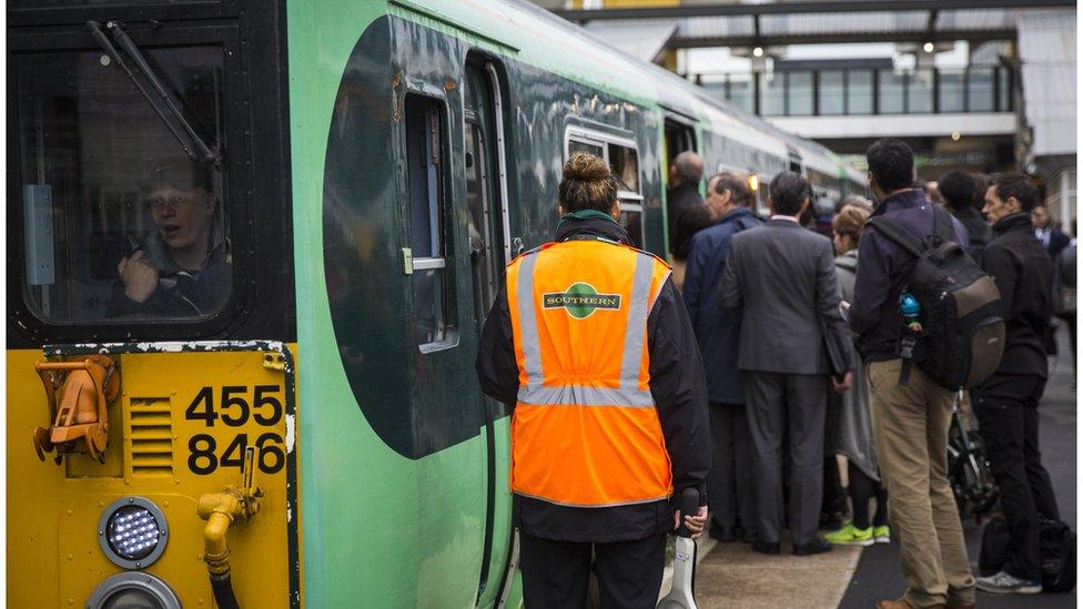 passengers getting on to crowded Southern rail train