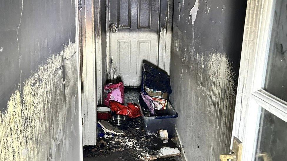 Aftermath of a house fire in Brandon, showing smoke-damaged interiors of the property.