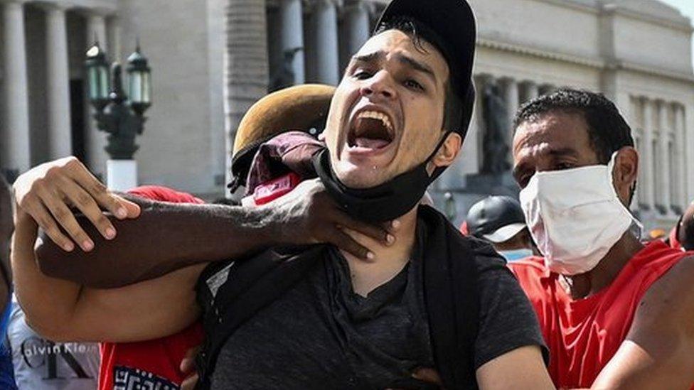 A man is arrested during a demonstration against the government of Cuban President Miguel Diaz-Canel in Havana