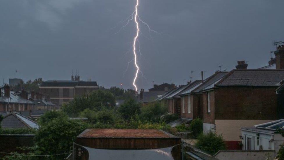 Lightning over Winchester rooftops