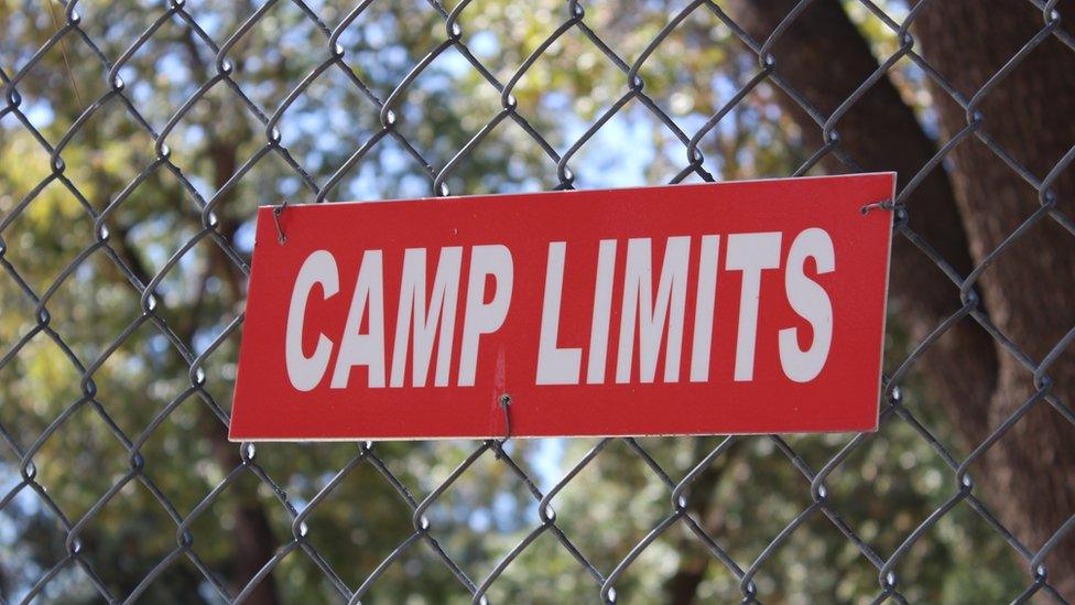 Camp limits sign