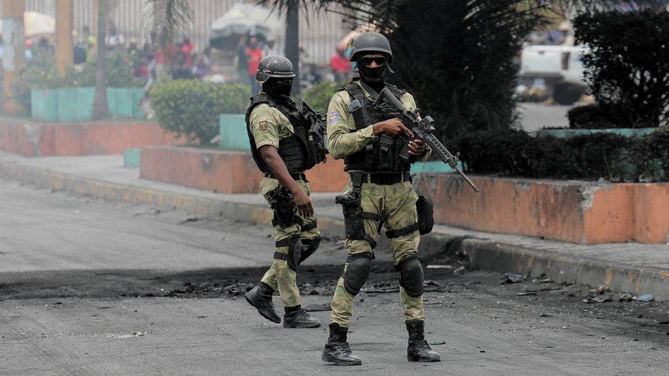 Police clear the street in Port-au-Prince, 14 July 2022