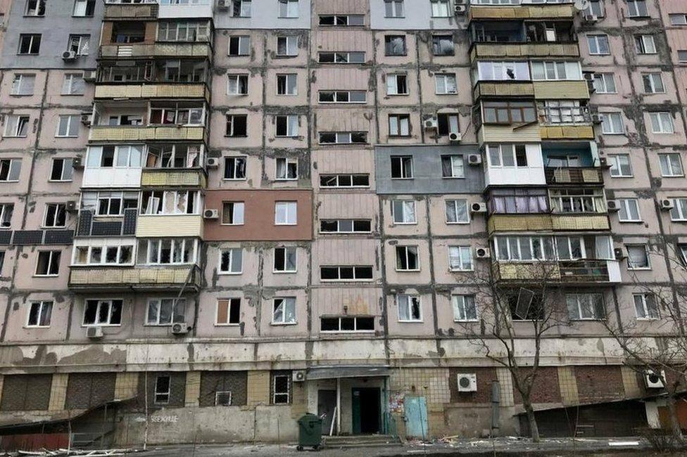 A damaged residential building in the Ukrainian port city of Mariupol