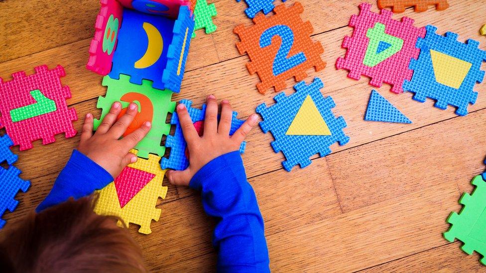 Child playing with squares