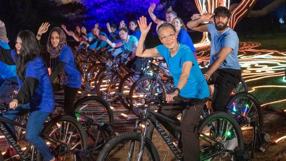 Riders powering a light display